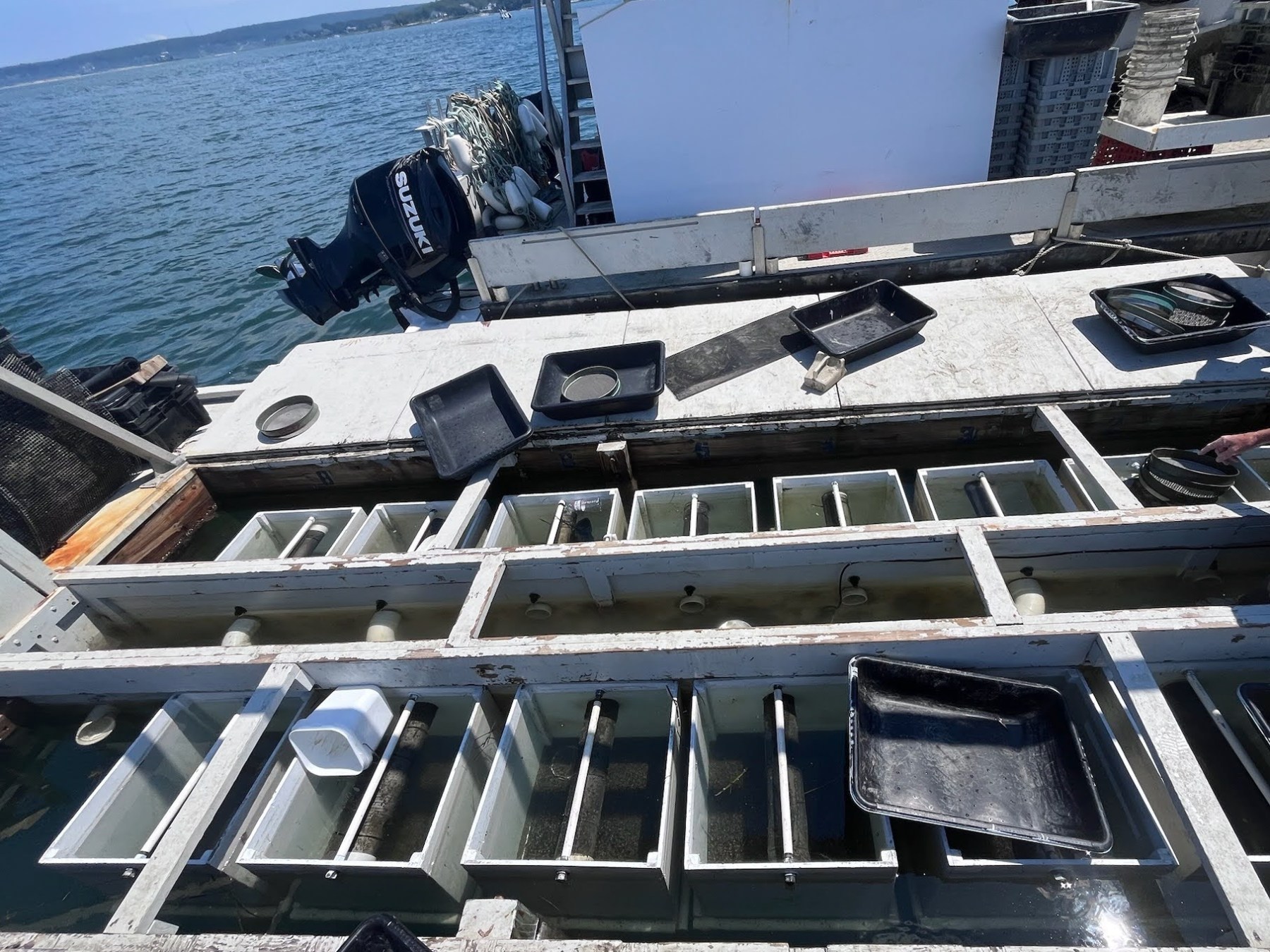 a boat sitting on top of a wooden fence