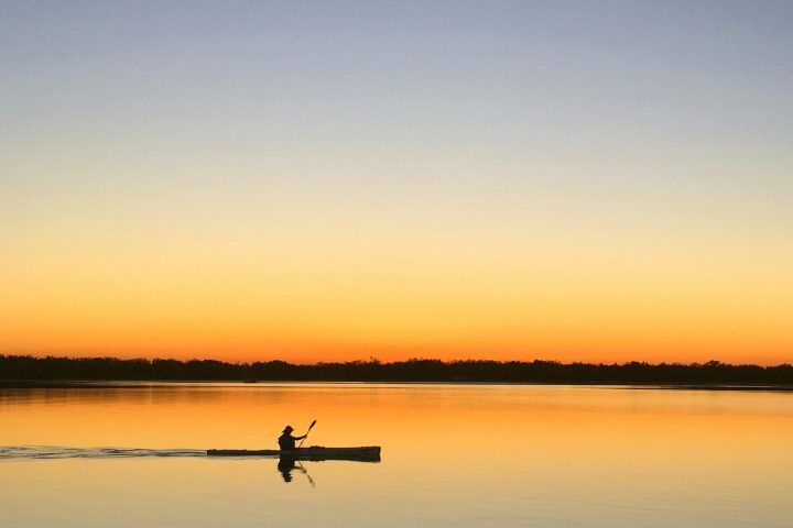 a sunset over a body of water
